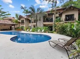 Modern Island-Themed Condo with Floor-to-Ceiling Windows & Garden and Pool Views Within Walking Distance of the Beach
