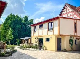 Amber Ferienhain - Ferienhaus 'Kirsche' mit verwunschenem Garten & privater Sauna