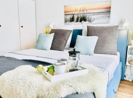 Surfbude, Olpenitz - moderne Ferienwohnung in direkter Strandnähe mit eigenem Eingang, Sauna, Kaminofen, Balkonterrasse und Parkplatz，位于奥尔本尼兹的酒店