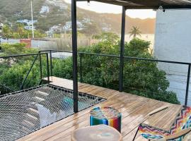 Ocean Lovers Hostel & Apartments，位于塔甘加的酒店
