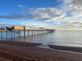 PINK HOUSE ,Opposite PIER & Beach ,SLEEPS 6 , 2 BEDROOM GROUND FLOOR SELF CONTAINED GARDEN FLAT , PRIVATE ENTRANCE , KITCHEN , Guaranteed Parking ,Wifi , Movies ,Bathroom ,fridge , microwave ,BEDROOM 1, DOUBLE BED & 2 SINGLE BEDS ,BEDROOM 2 , DOUBLE BED