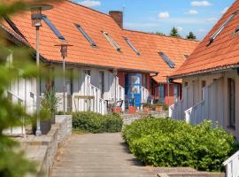 5 person holiday home on a holiday park in Gudhjem，位于古兹耶姆的酒店