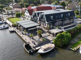 Appartementen De Helling 44，位于希格的带热水浴缸的酒店