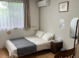 ゲストハウス假穂，位于舆论町的酒店