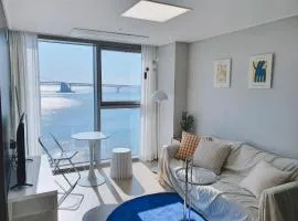 Gwangalli Beachfront House with a beam projector