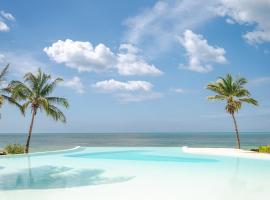 Zanbluu Beach Hotel，位于吉汶瓦的木屋