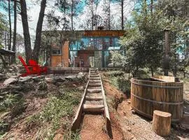 Cozy cabin in the woods with a wooden tub