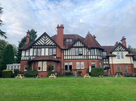 OYO Dunmar House Hotel，位于阿洛厄的酒店