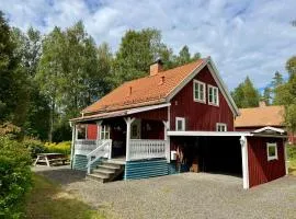 House near forest and water