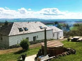 Buzzard Cottage nestled in a hillside farm