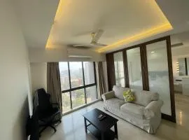 Business-Ready Apt near Jio World Centre 1BR Gym Pool WiFi