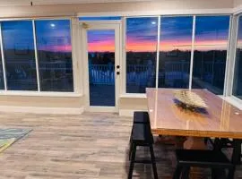 Gorgeous vacation home on the water with heated pool and sand!