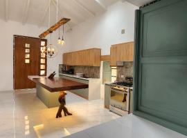 Cozy rural house with WiFi and garden in Pujilí，位于Pujilí的酒店