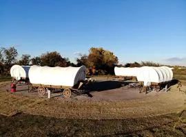 Perfect Glamping Vacations in this Rustic Conestoga Covered Wagon Rental in Oklahoma