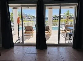 5 Bed3bath waterfront pool home with full gym, office, and heated pool!