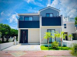 Tropical Beach Vacation House，位于宜野湾市的酒店
