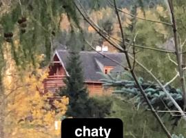 Chaty Świerkowe Wzgórze - domki typu superior z sauną balią kominkiem i domki-bez sauny balii kominka，位于卡尔帕奇的酒店