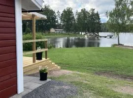 Red Cottage with Lakefront Location at Nerbjärken