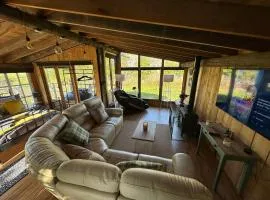 Escape to the Country, Lodge, Retreat, Cabin over small river, private hot tub & log burner, WiFi, 65 inch smart TV relax read at Weston Newark, Nottinghamshire