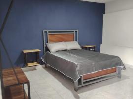 minidepartamento a unos pasos de la gran pir&aacute;mide，位于乔卢拉的自助式住宿