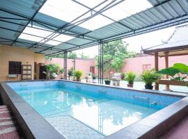 Griya Mustika Homestay Syariah Cangkringan Kaliurang RedPartner，位于Kentisari的酒店