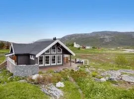 Hytte ved havet på Brensholmen, nær Sommarøy, Tromsø