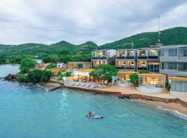 Madusea Grand Villa มาดูซี แกรนด์ วิลล่า，位于格兰岛的带泳池的酒店