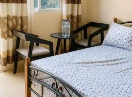 Cozy Guest Room in Kinshasa with Balcony and Partial Air-Conditioning