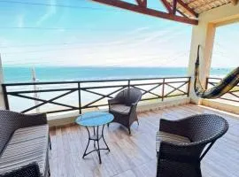 Casa da Maré Pé na areia Suítes climatizadas e deck vista mar