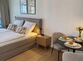 Modernes Seeblick Apartment mit Sauna und Poolnutzung，位于默讷塞的酒店