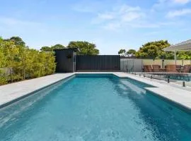 Luxe 4BR Retreat with Heated Pool & Finnish Sauna, Steps to the Beach