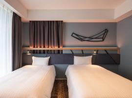 QuintessaHotel Osakaumeda Comic&Books，位于大阪的酒店