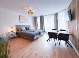 MOIN Apartments - Studio mit Balkon & Parkplatz, Wifi und TV
