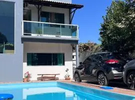 Casa de Verão, 04 quartos, 03 banheiros, piscina e churrasqueira para relaxar