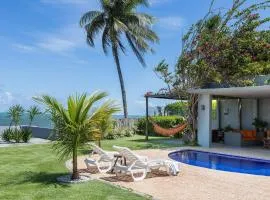 Casa Ilha| beira mar, piscina aquecida, 4 suítes