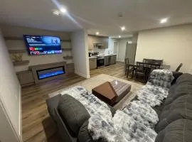Peaceful 2BR Getaway with Fireplace & Parking Basement Suite