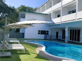 阿米蒂奇酒店及会议中心，位于陶朗加的酒店