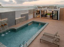 Casa de praia pé na areia, alto padrão, 07 quartos，位于德奥多鲁元帅镇的酒店