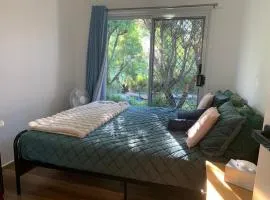 Fabulous Stunning Garden View King Bedroom with shared bathroom at MC 2079