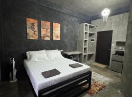 greyhouse moalboal queen bed，位于莫阿尔博阿的酒店