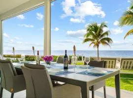Sunset Point Vacations Luxury Oceanfront Condo with Private Garden West Bay