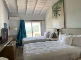 Queen Deluxe Plus at Boundless Bliss Hotel，位于Raphune的酒店