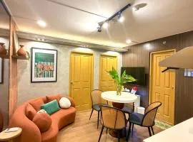 House of Keul - 2BR cozy condo in Dumaguete with pool and free laundry for long term guests up to 4 pax