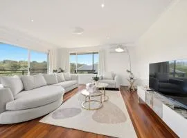 Luxury 4BR Home with Stunning Bay Views at Kareela