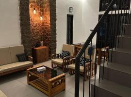 Asramom Home，位于奎隆的酒店