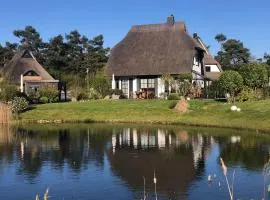Holiday Home Reetdachhaus am Wasser mit Sauna- Außenwhirlpool- Kamin und E-Ladestation by Interhome