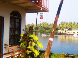 RivoGoa Homestay - riverside cottage near mopa airport，位于Bardez的酒店