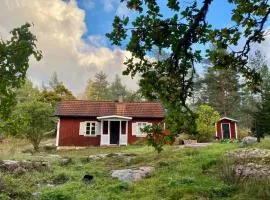 Our classic red cottage in the woods