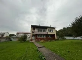 House with mountain views and garden by the stream