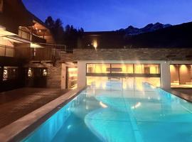 Aparthotel Familiaris - Family Apartments - Pools & Spa in Dolomites，位于瓦尔道拉的酒店